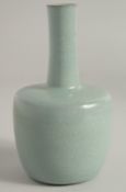 A CHINESE RU STYLE CELADON BOTTLE VASE, 16cm high.