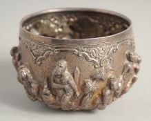 A SMALL INDIAN EMBOSSED SILVER BOWL, with relief decoration of figures / deities, 10cm diameter,