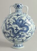 A CHINESE BLUE AND WHITE PORCELAIN TWIN HANDLE MOON FLASK, painted to each side with a dragon and