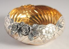 A TURKISH SILVER CIRCULAR BOWL, with repousse decoration and applied flower head mounts, stamped