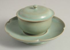 A CHINESE RUI-WARE STYLE CELADON PORCELAIN TEA SET, comprising a tea bowl and cover, with petal-