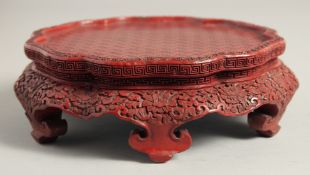 A FINE CHINESE CINNABAR LACQUER PETAL FORM STAND, with fine incised pattern work to the top and