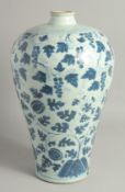 A LARGE CHINESE BLUE AND WHITE PORCELAIN MEIPING VASE painted with fruit and leaves. 41cm high