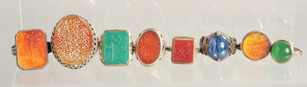 EIGHT ISLAMIC RINGS; INCLUDING SIX CALLIGRAPHIC SEALS, various stones, (8).