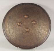 A 19TH CENTURY INDIAN RAJHASTAN GOLD-KOFTGARI STEEL SHIELD (DAHL), mounted with four steel bosses,