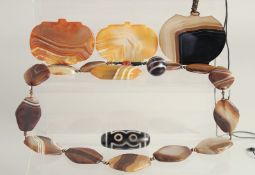 SEVEN AGATE PIECES, including a beaded necklace, a pendant on string, three single pendants and