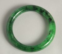 A CHINESE JADEITE BANGLE.