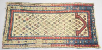 AN 18TH CENTURY CAUCASIAN PRAYER RUG, the central cream ground panel with stylised tree decoration