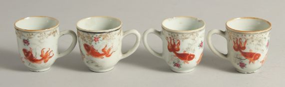 FOUR 18TH CENTURY CHINESE FAMILLE ROSE PORCELAIN TEACUPS, painted with iron red carp and flora. 6.