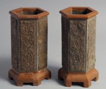 A PAIR OF CHINESE HEXAGONAL SOAPSTONE VASES, 19cm high.