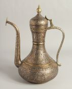 A FINE 19TH CENTURY MAMLUK REVIVAL SILVER AND COPPER INLAID BRASS EWER, with finely engraved
