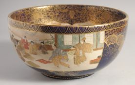 A LARGE JAPANESE MEIJI PERIOD BLUE-GROUND SATSUMA BOWL, the interior painted with a travelling