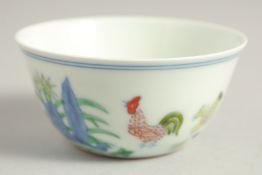 A CHINESE DOUCAI PORCELAIN CHICKEN CUP, six-character mark to base, 8cm diameter.