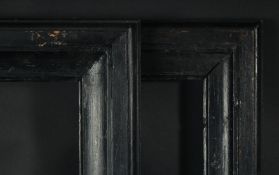 A pair of ebonised moulded frames, rebate size 23.5