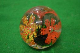 A glass paperweight.