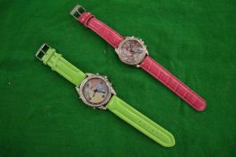 Two large wristwatches.