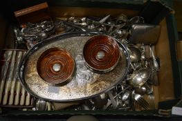 A quantity of plated flatware and other items to include a pair of bottle coasters.