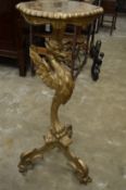 An Italian carved gilt wood pedestal table.