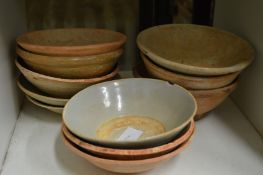 A quantity of Chinese terracotta bowls.
