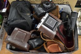 Camera equipment and binoculars.