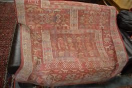 A Persian design carpet decorated all over with buildings, animals and figures, 250cms x 150cms.