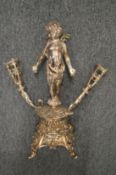 A plated epergne or centrepiece base, modelled as a standing cherub.