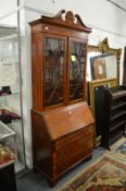 An Edwardian mahogany bureau bookcase.