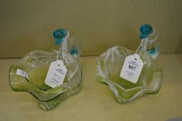A pair of glass bowls modelled as birds.