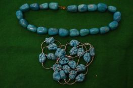 Two turquoise bead necklaces.