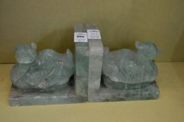 A pair of carved green quartz duck book-ends.