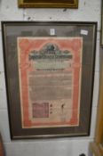 An Imperial Chinese Government Railway Bond for $100, framed and glazed and another similar.