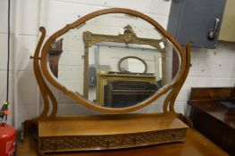 A large mahogany dressing table mirror.