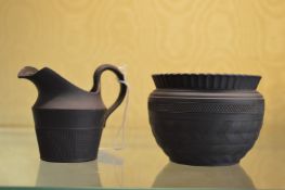 A small black Jasper ware jug and bowl.