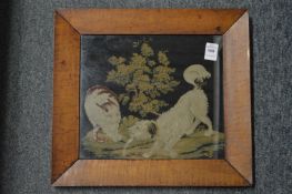 A Victorian embroidery depicting a dog and a cat, in a maple frame.