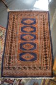 A modern blue ground Bokhara style rug, 148cms x 100cms.