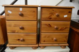 A pair of pine bedside chests.