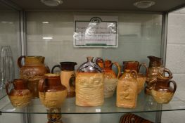 A good collection of salt glazed jugs and flasks.