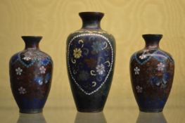 Three small cloisonne vases.