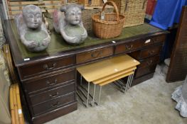 A reproduction mahogany pedestal partners desk.