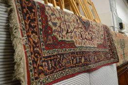 A machine made Persian style rug, 160cms x 112cms.