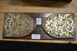A Victorian walnut and brass book slide.