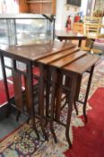 A nest of four mahogany tables.