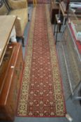 A modern machine-made runner, 460cms x 66cms.