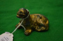 A Chinese gilded metal seated model of a lion.