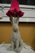 A novelty table lamp in the form of a hare.