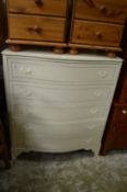 A painted chest of drawers.