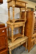 A pair of small pine side tables and two drawer table.