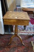 A 19th century continental olive wood combination games / work table with hinged folding top on