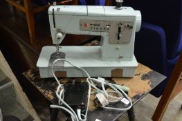 An early electric Singer sewing machine.