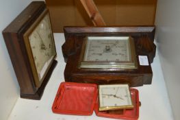 Two clocks and a barometer.